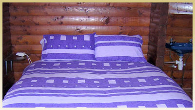 The bed in the master bedroom